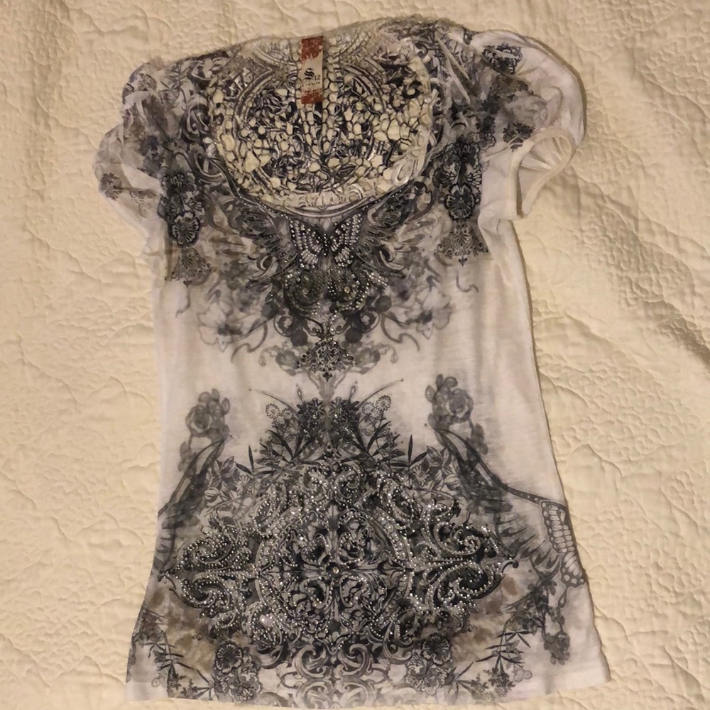 Lace back embellishment top.